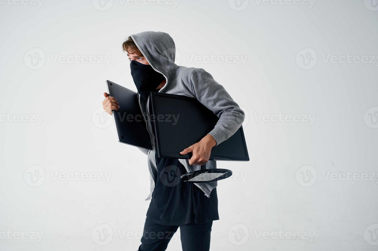 masked man hooded head hacking technology security light background photo