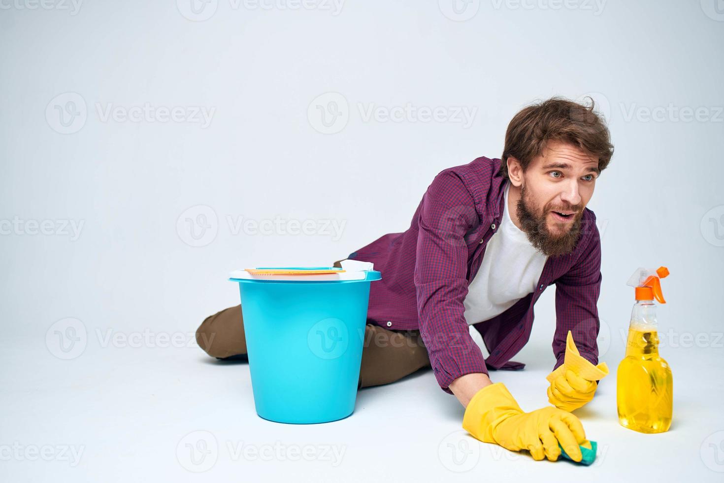 cleaner in rubber gloves washing floors housework light background photo