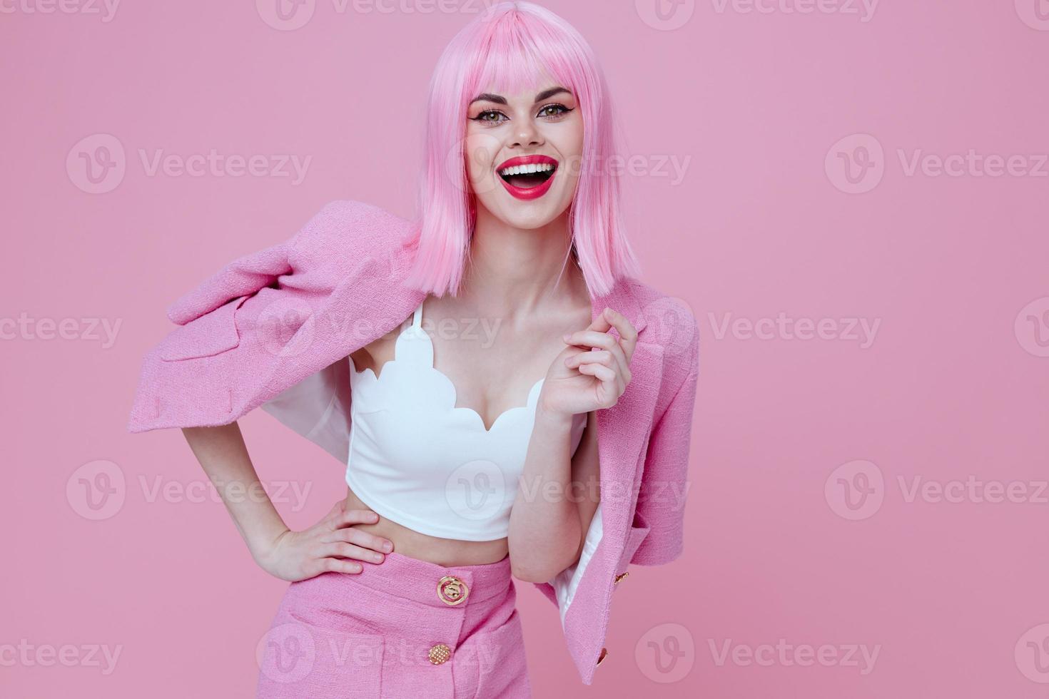Portrait of a charming lady gestures with his hands with a pink jacket pink background unaltered photo