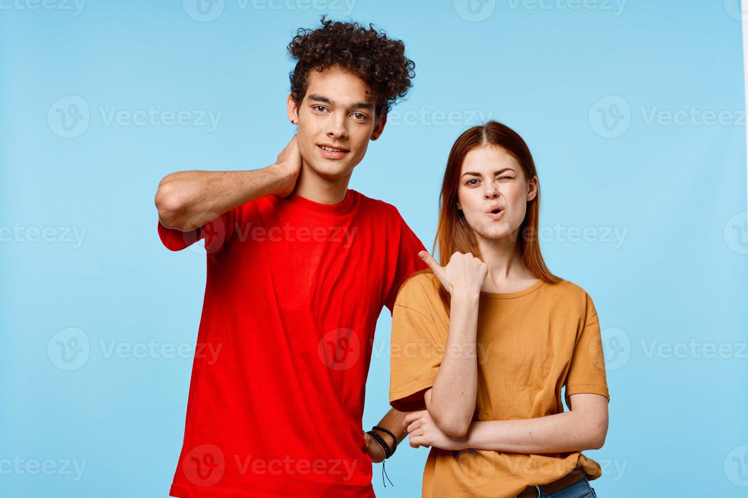 man and woman in multicolored t-shirts communication emotions modern style photo