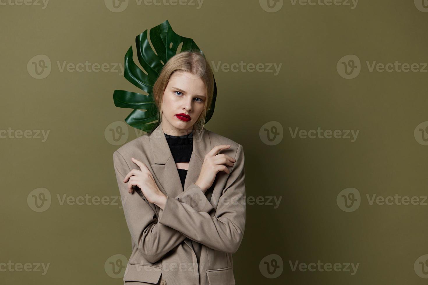 blonde woman red lips palm leaf charm fashion isolated background photo