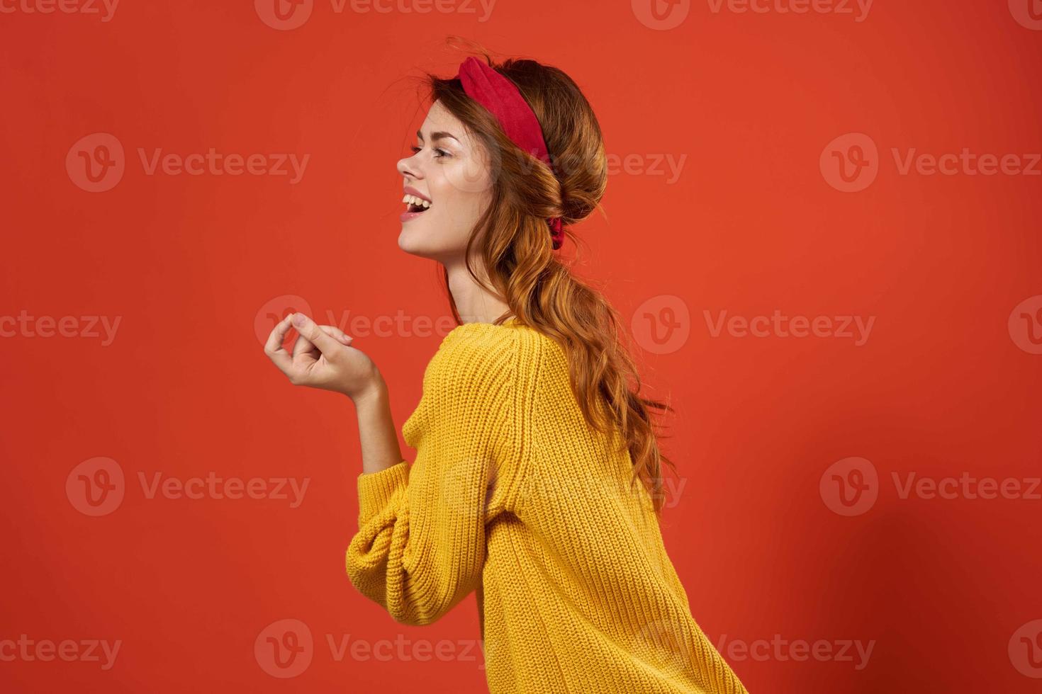 cheerful woman in yellow sweater red headband decoration fashion street style photo