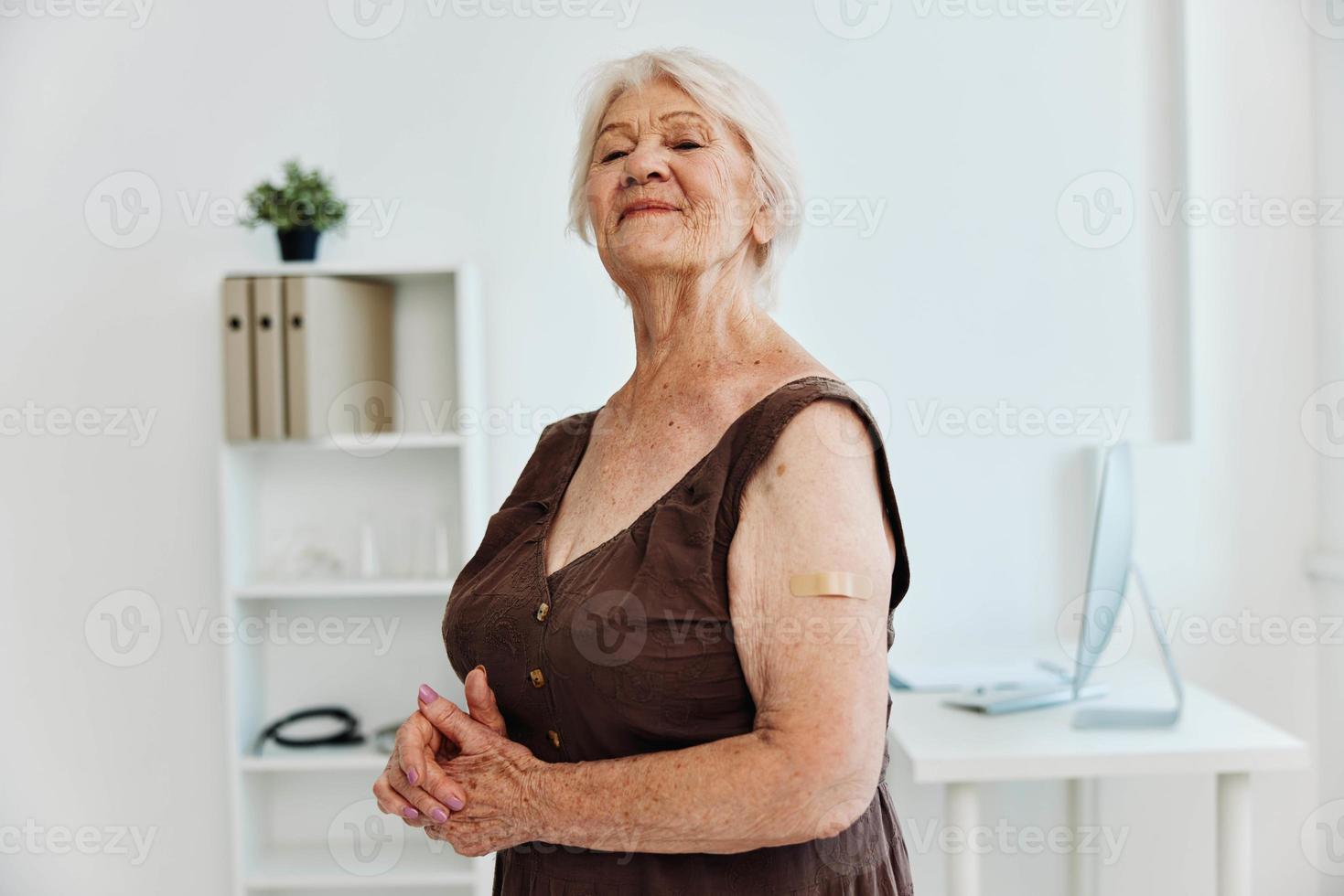 person with plaster on hand covid passport immunization safety photo
