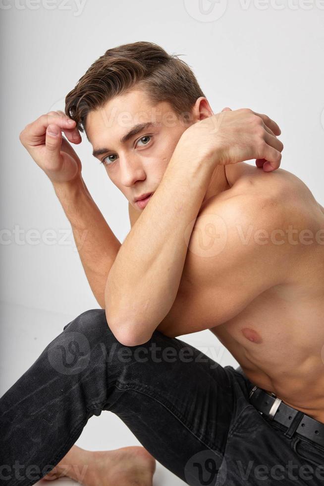 handsome man fashionable hairstyle naked torso attractive look close-up photo