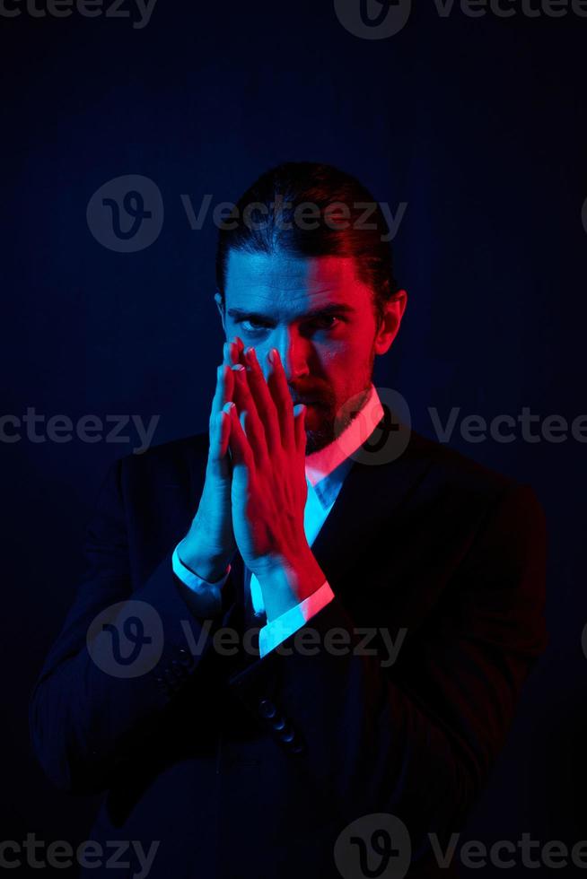 handsome man in costume posing fashion neon light photo