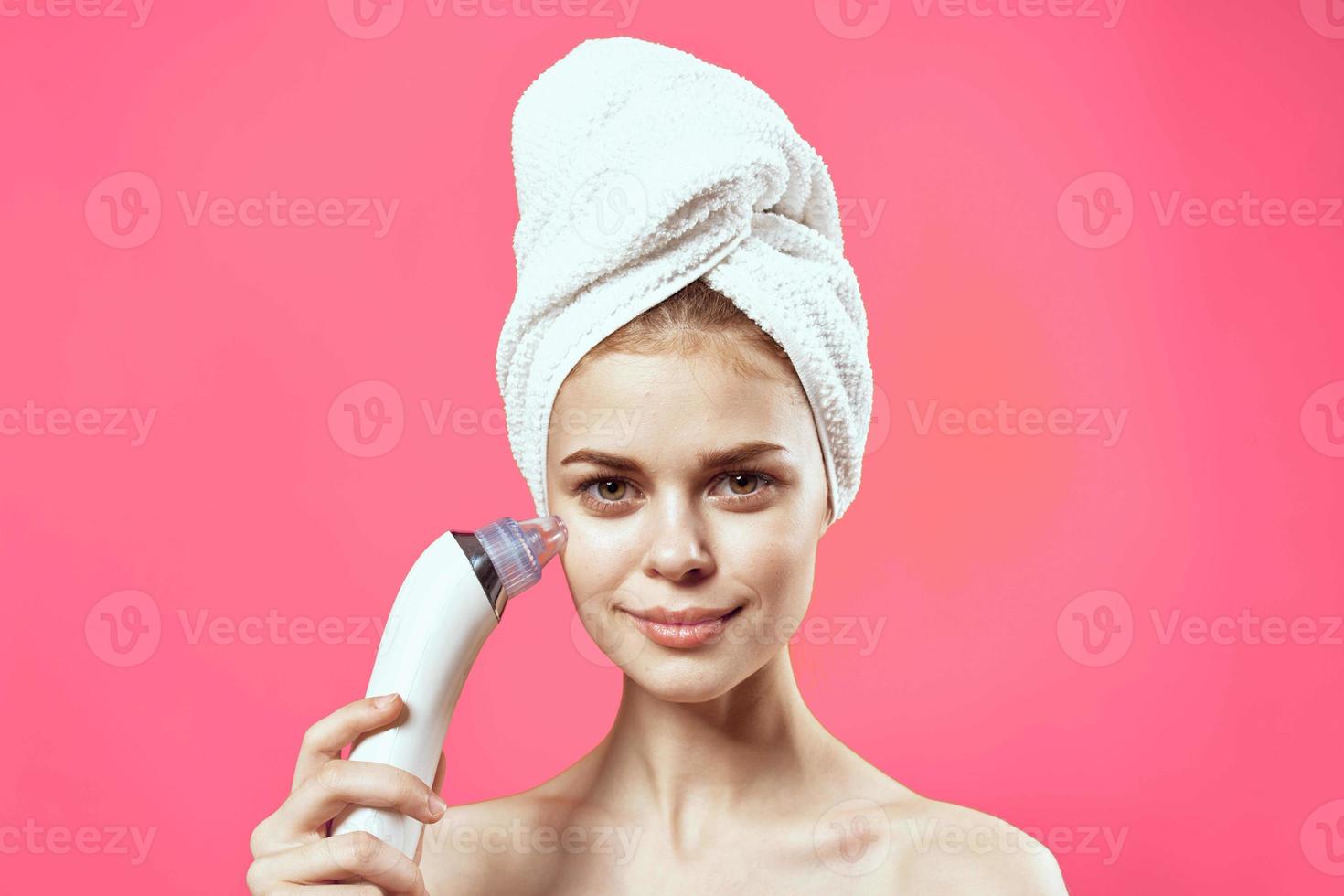 emotional woman with bare shoulders cleansing face dermatology procedure photo