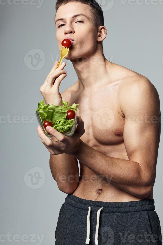 sportive man plate salad healthy food lifestyle diet workout photo