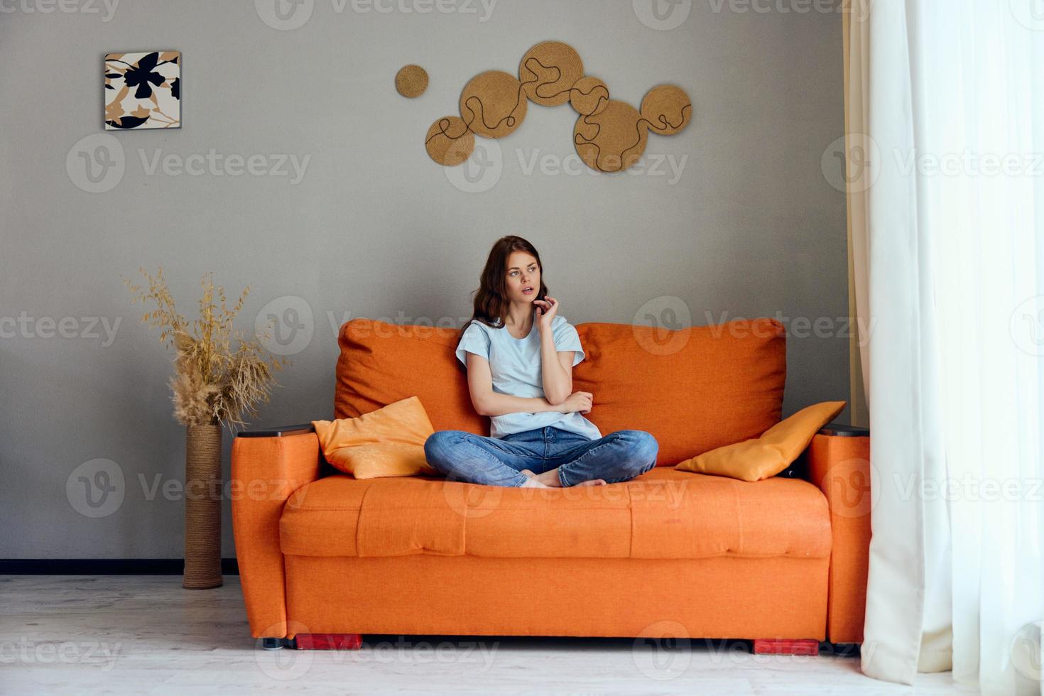 woman on the couch rest fun Comfort apartments photo