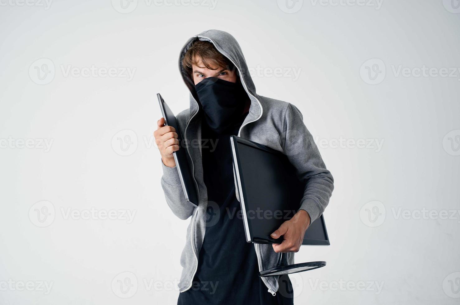 masked man crime anonymity caution balaclava isolated background photo