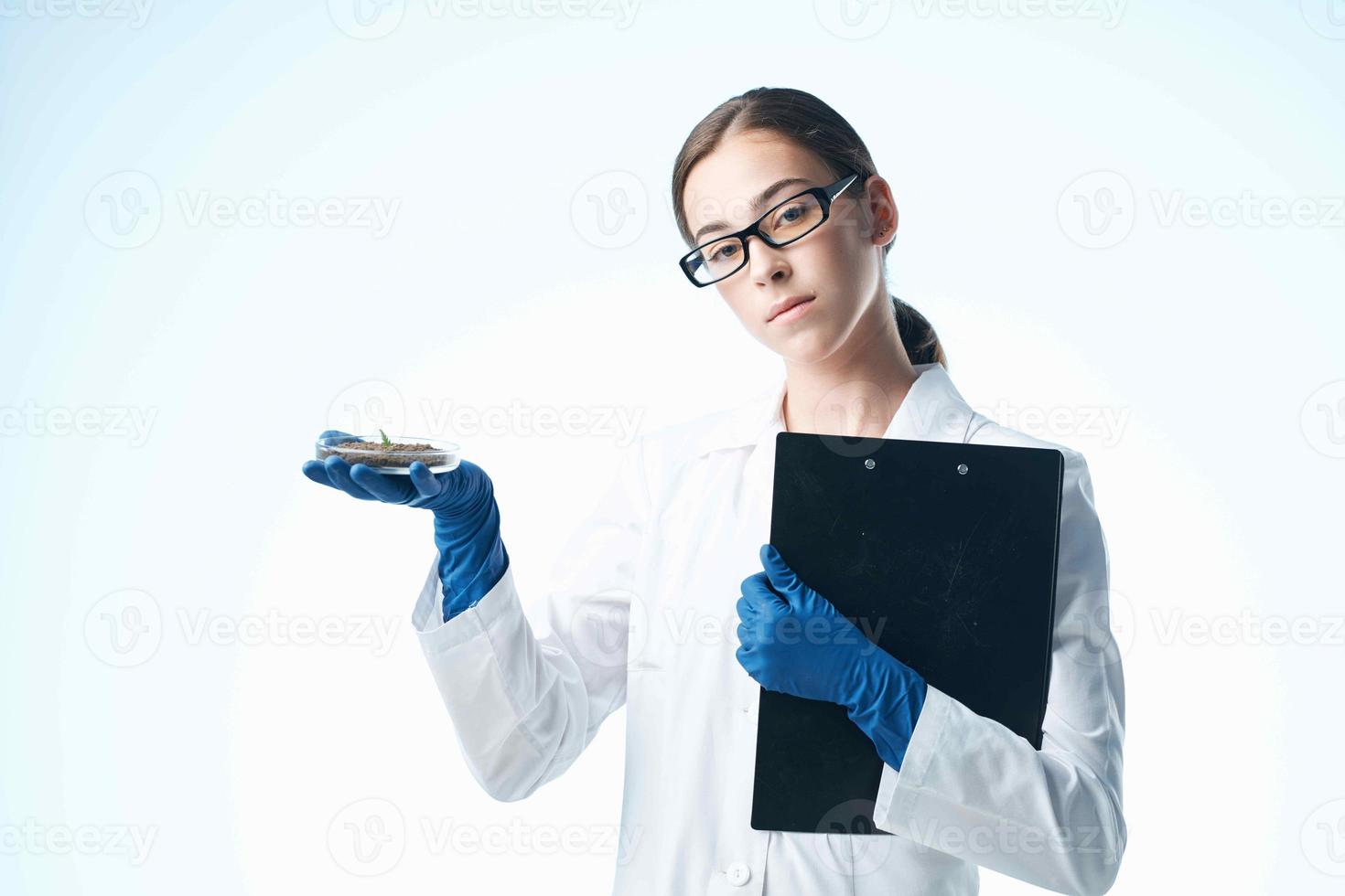 Woman in White Coat Biology Research Professional photo