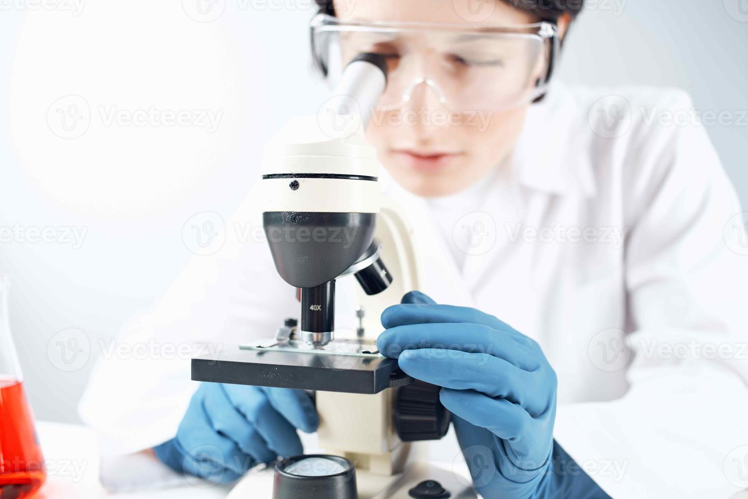 woman laboratory assistant microscope science professional analysis biotechnology photo