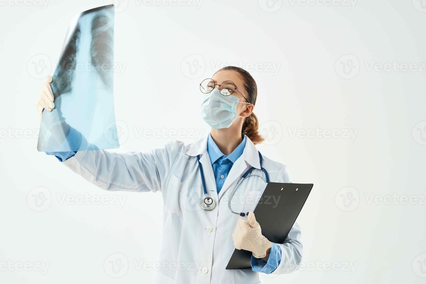 female doctor with x-ray in hands examination diagnostics hospital photo