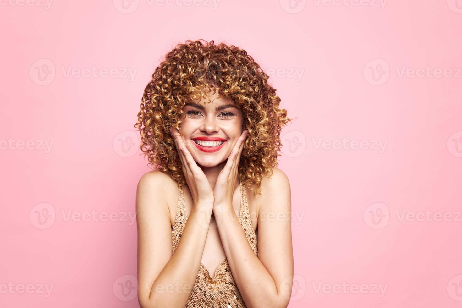 Female portrait Touch your face with your hands for curly hair charm model photo