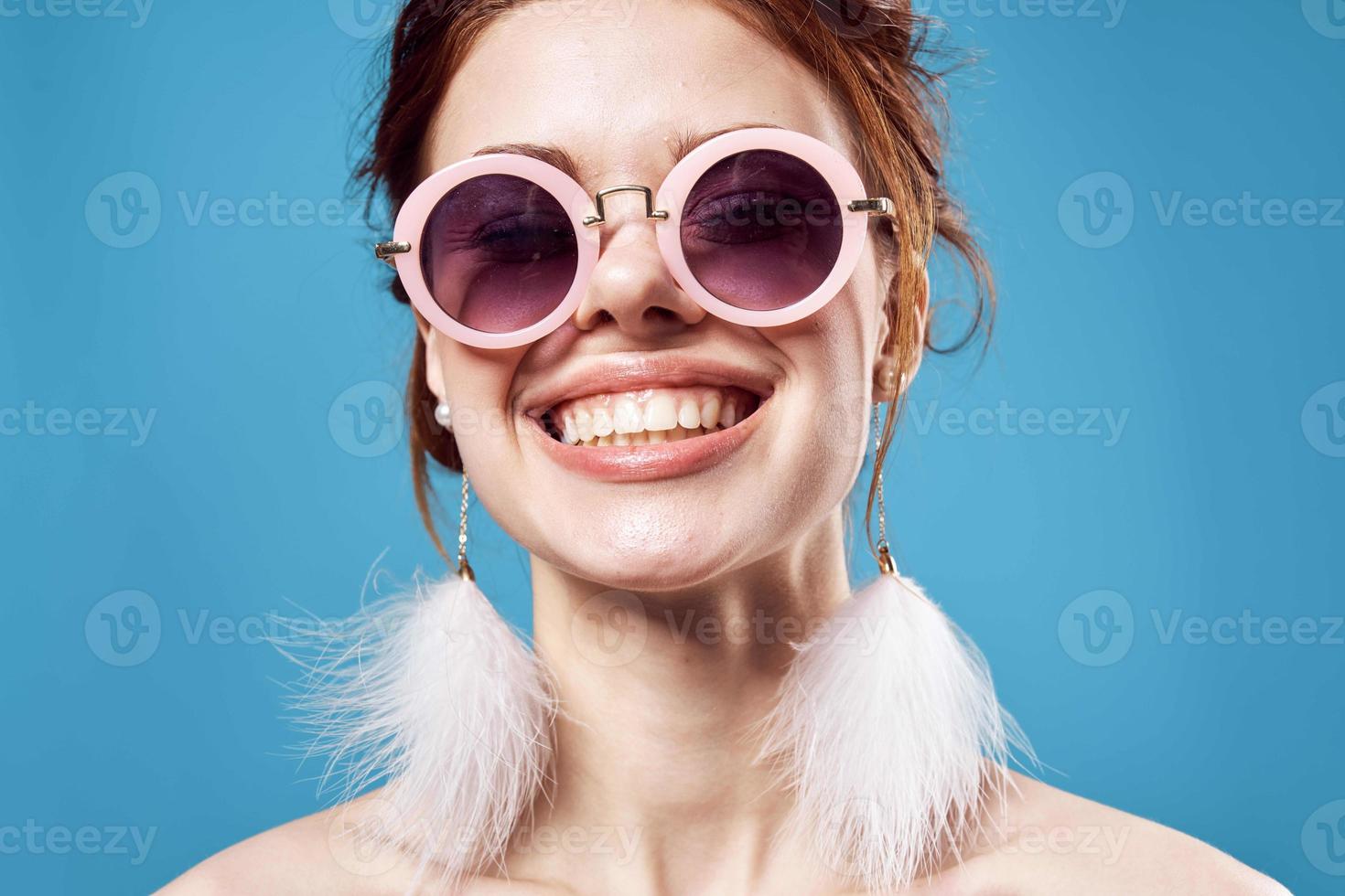 pretty woman in sunglasses bare shoulders fun young close-up photo