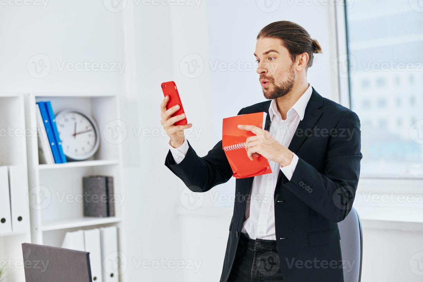 Man office work documents with a phone in hand technology photo