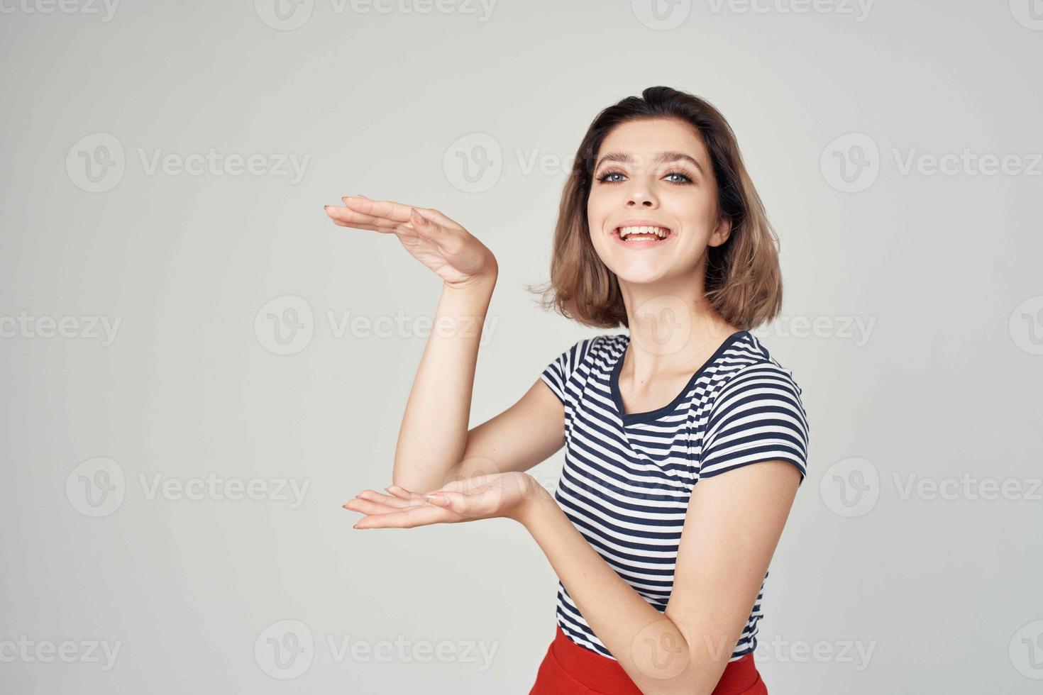 beautiful woman in fashionable clothes Red skirt posing Studio photo