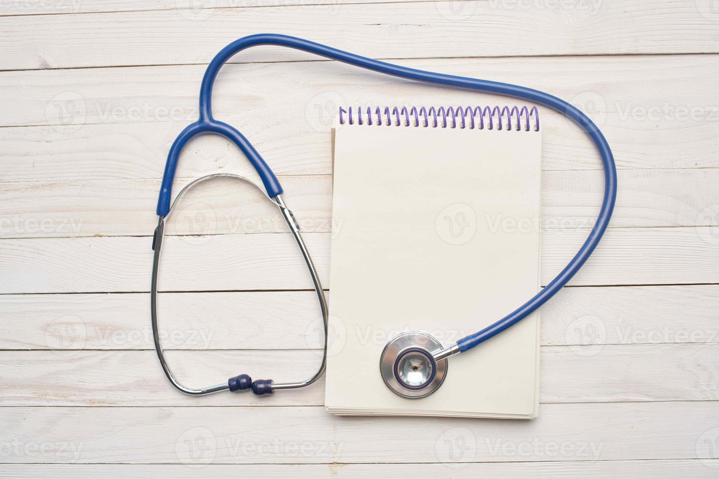 Stethoscope notepad medicine treatment top view photo