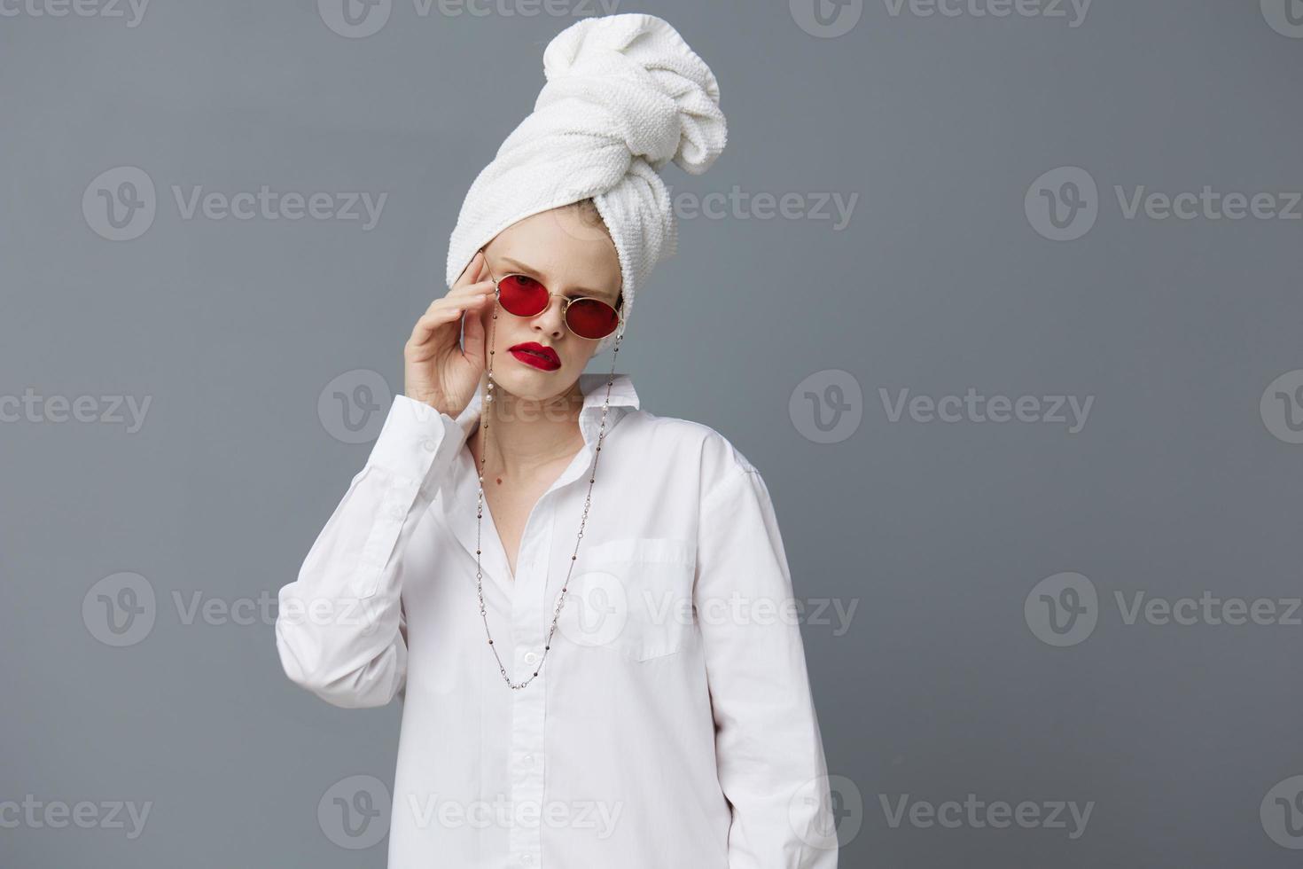 portrait of a woman red sunglasses cosmetics with towel on head Lifestyle posing photo