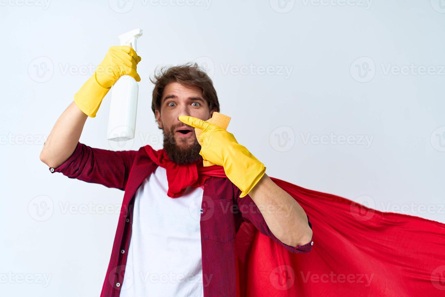 Man with detergent in hands in rubber gloves professional housework cleaning photo