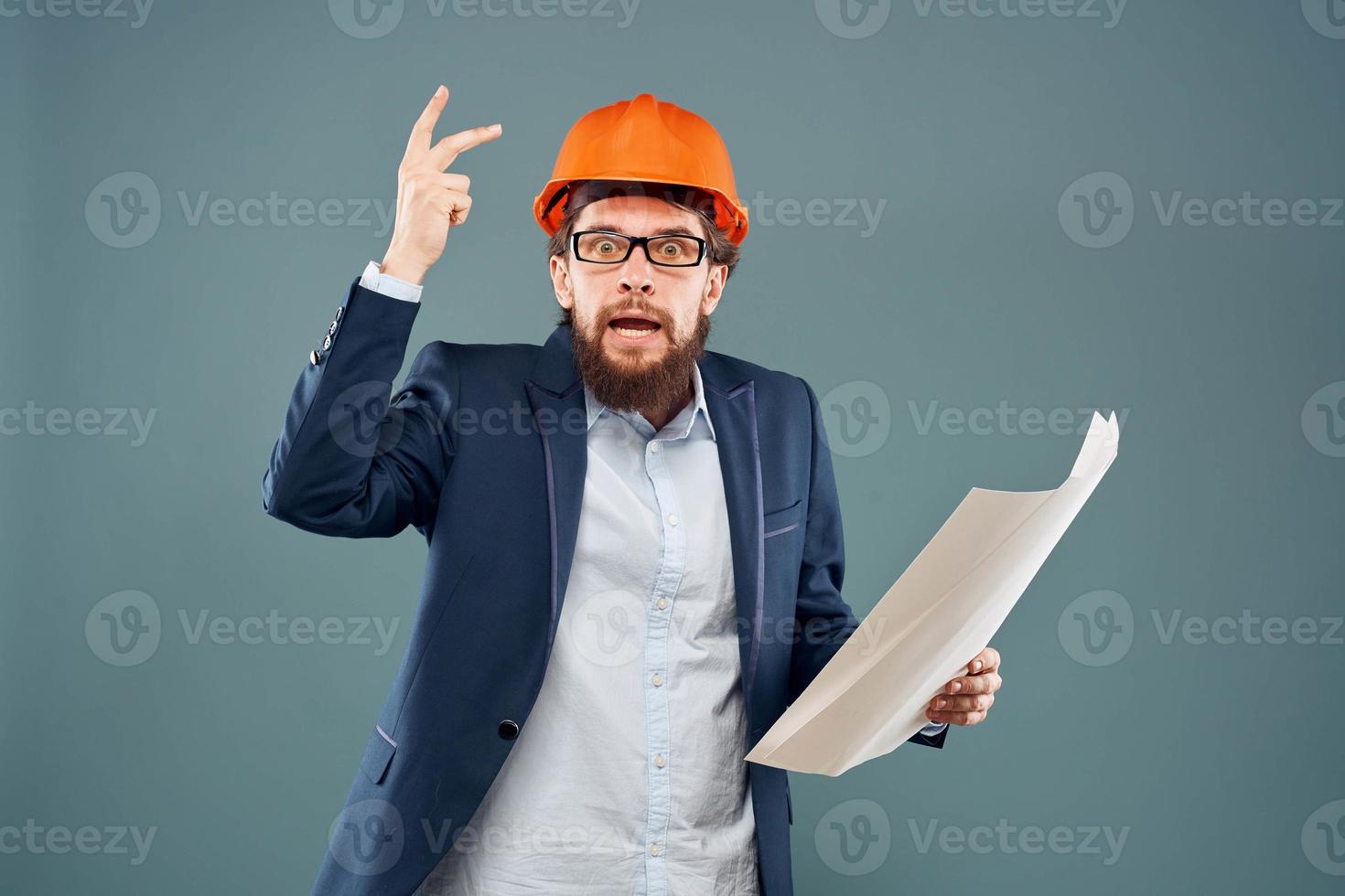 Emotional man in orange coloring drawings instruction manual construction work photo