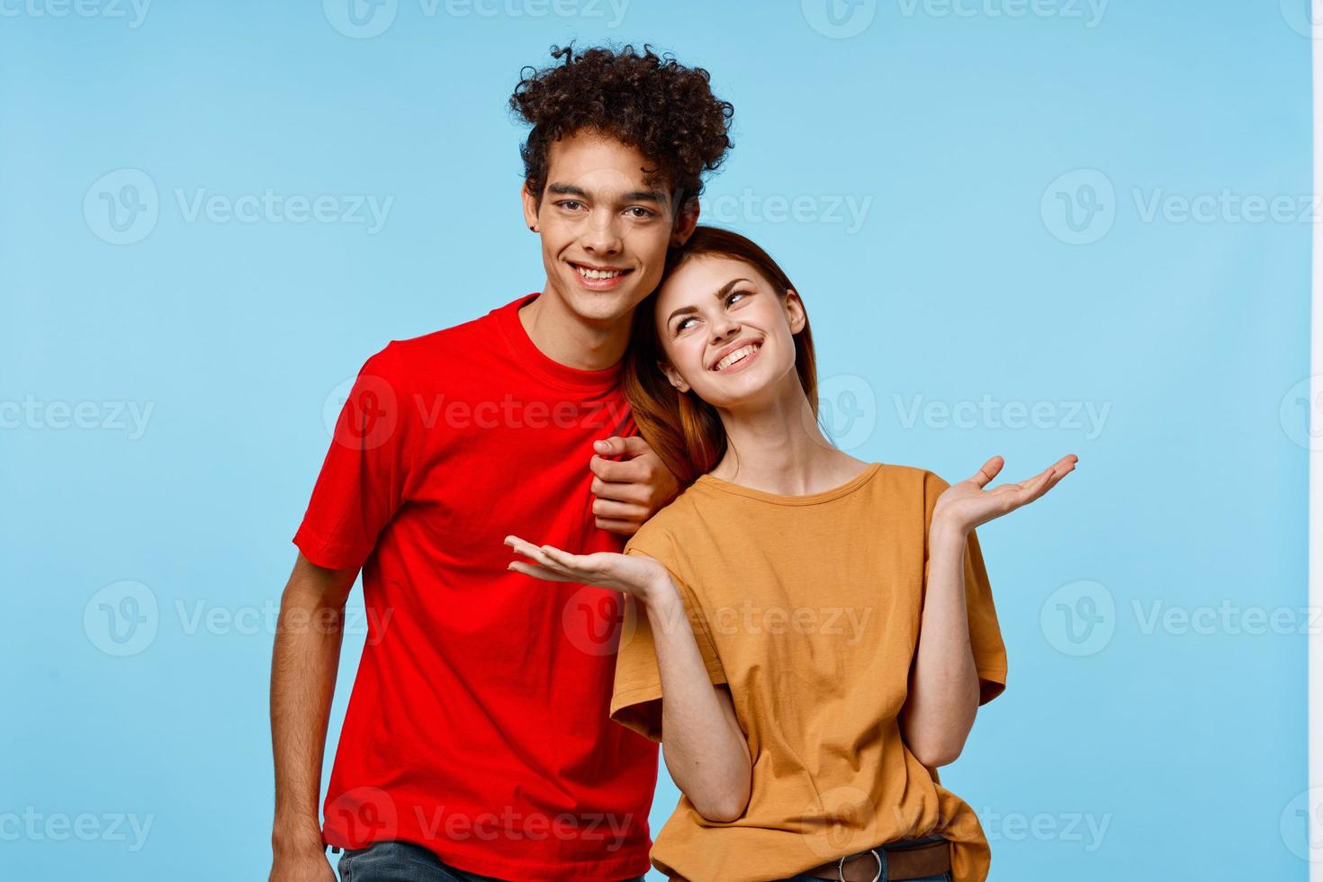 cheerful young couple hugs communication fun fashion photo