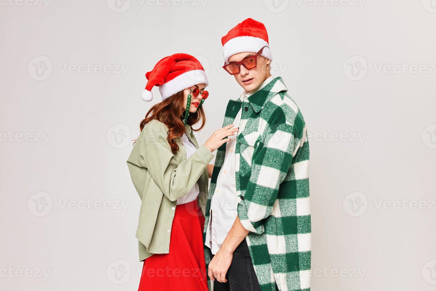 Young couple stand next to each other embrace the New Year holiday togetherness photo