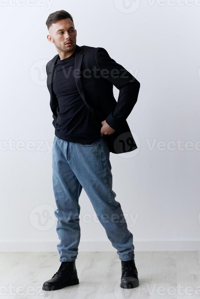 Modelling snapshots. Serious narcissistic self-confident attractive handsome man in classic suit jacket posing isolated in white studio background. Fashion offer. Copy space for ad. Full body shot photo