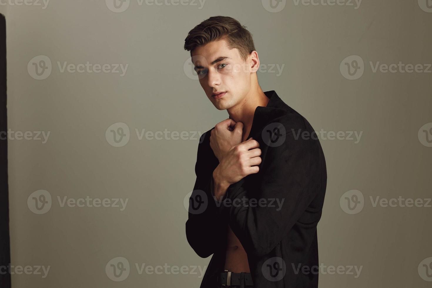Cute young guy and fashionable hairstyle black shirt self-confidence photo