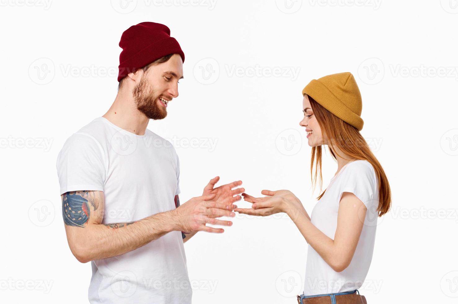 young couple in white t-shirts fashion posing studio photo