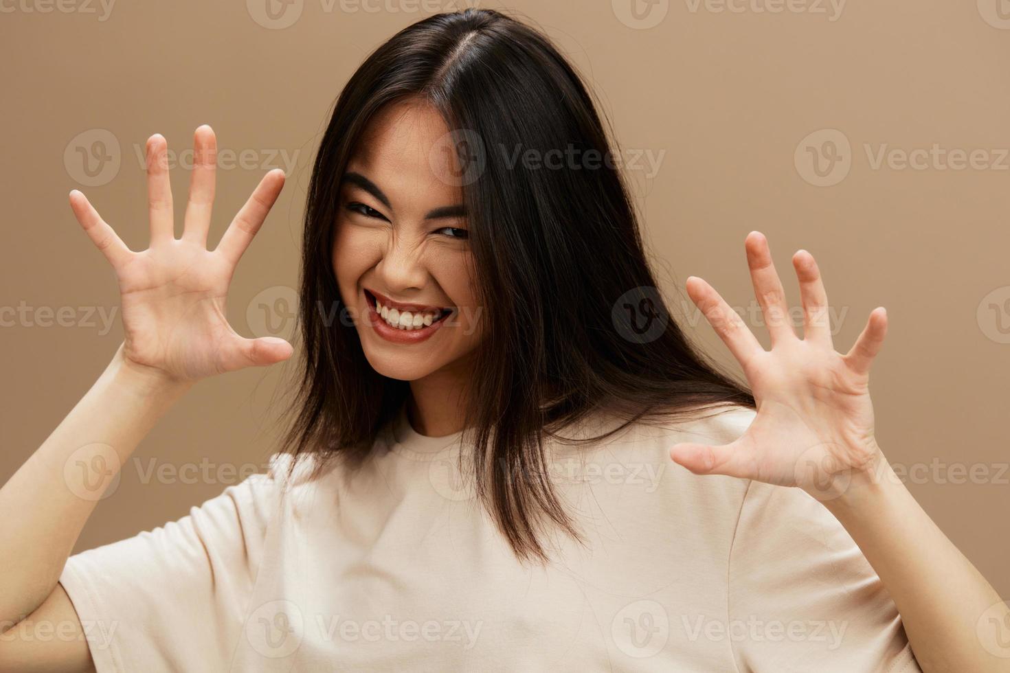 woman attractive look charmin in a t-shirt beige background photo