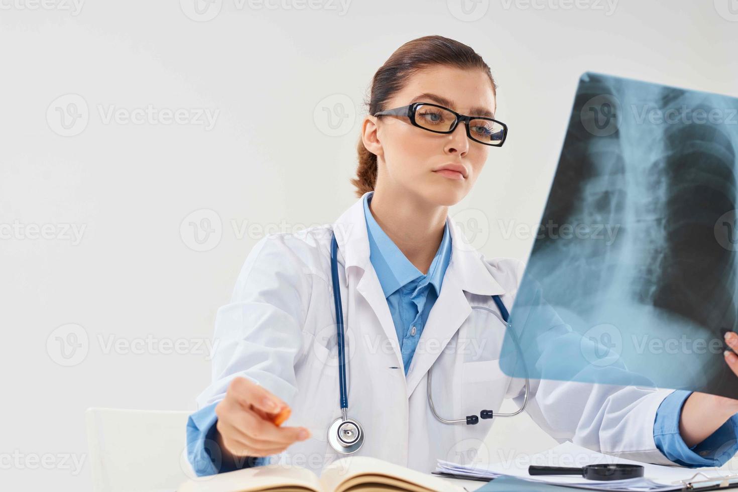 female doctor in white coat x-ray diagnostics medicine photo