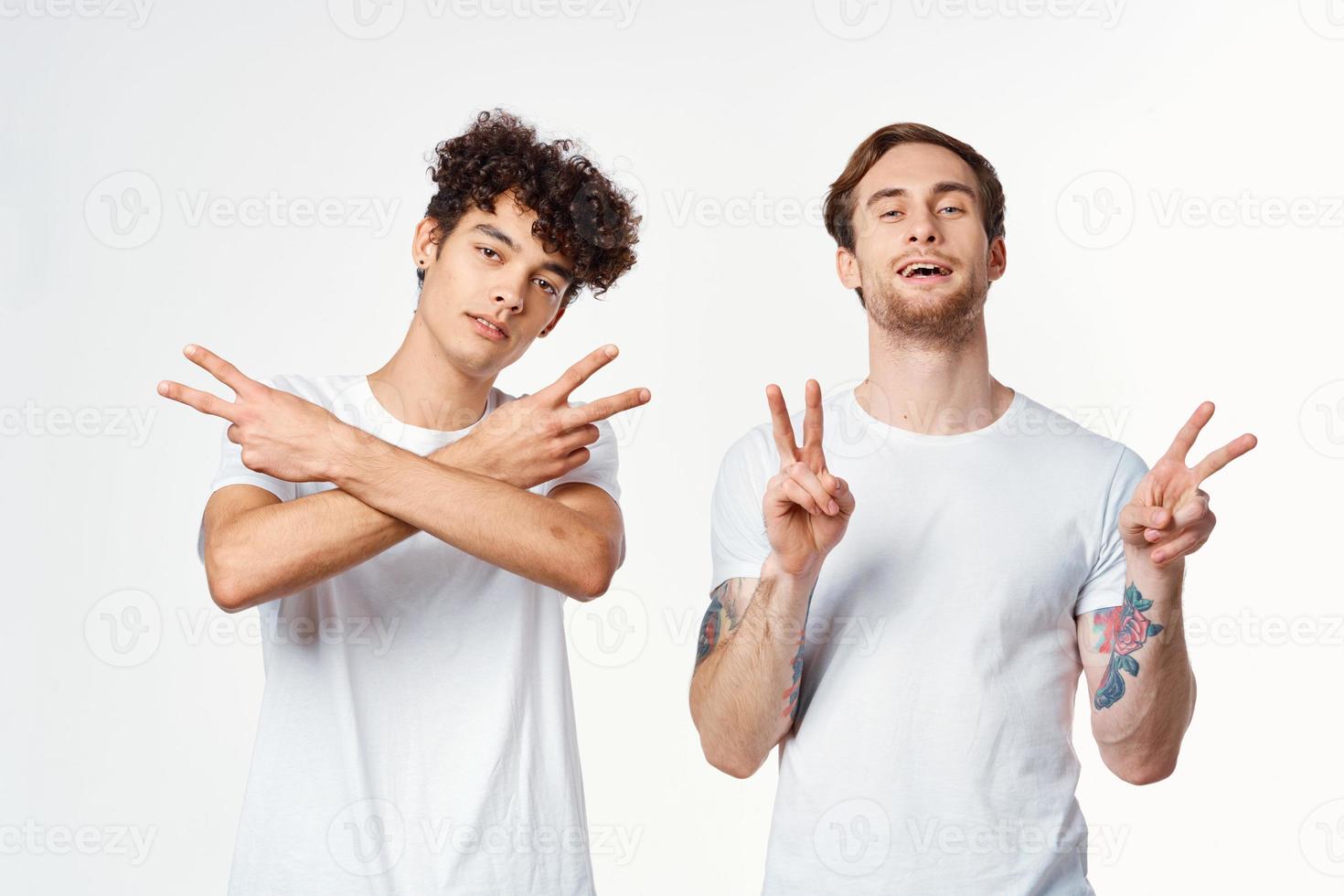 two men are standing next to clean t-shirts emotions communication studio photo