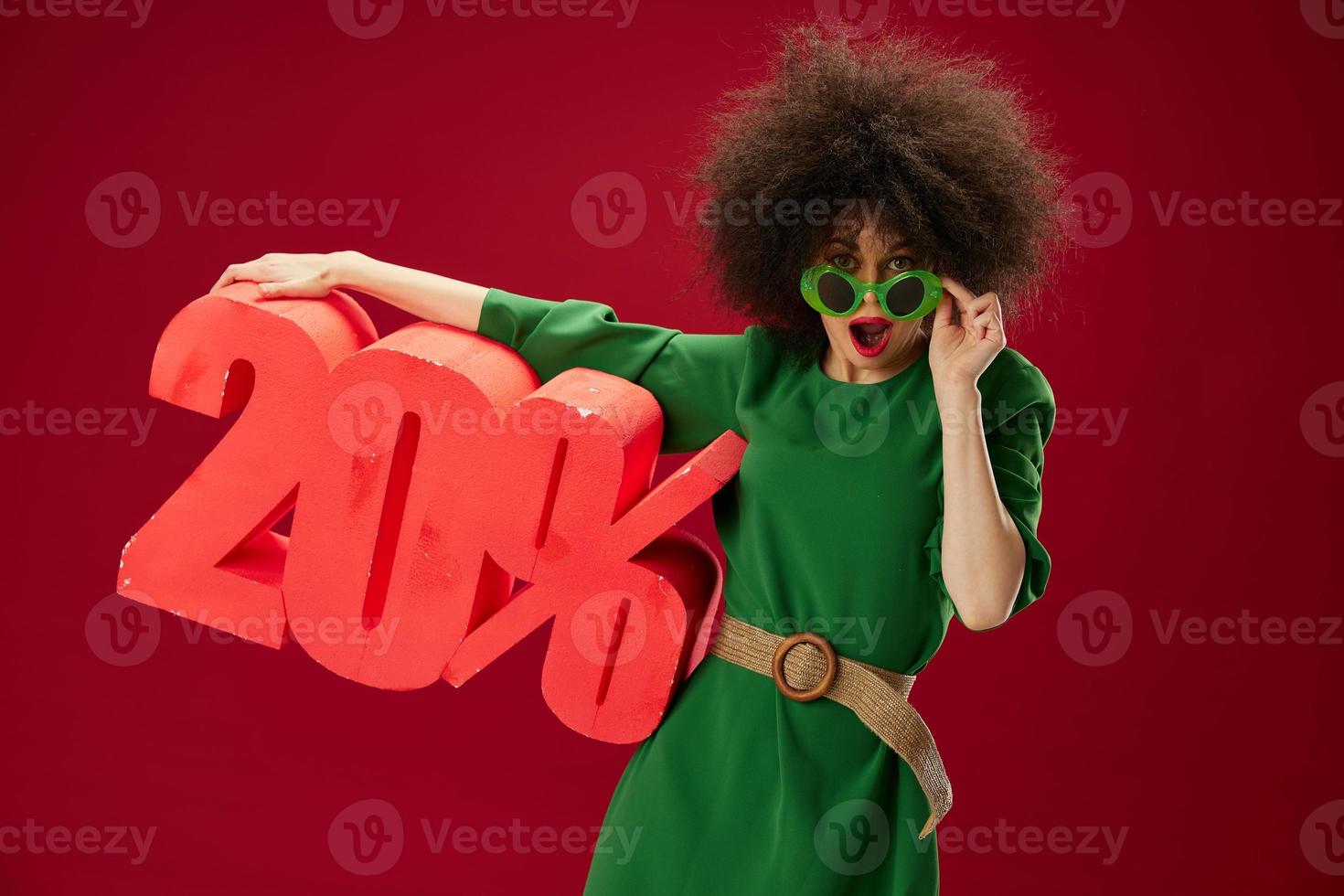 Beauty Fashion woman curly hairstyles green dress twenty percent discount studio model unaltered photo