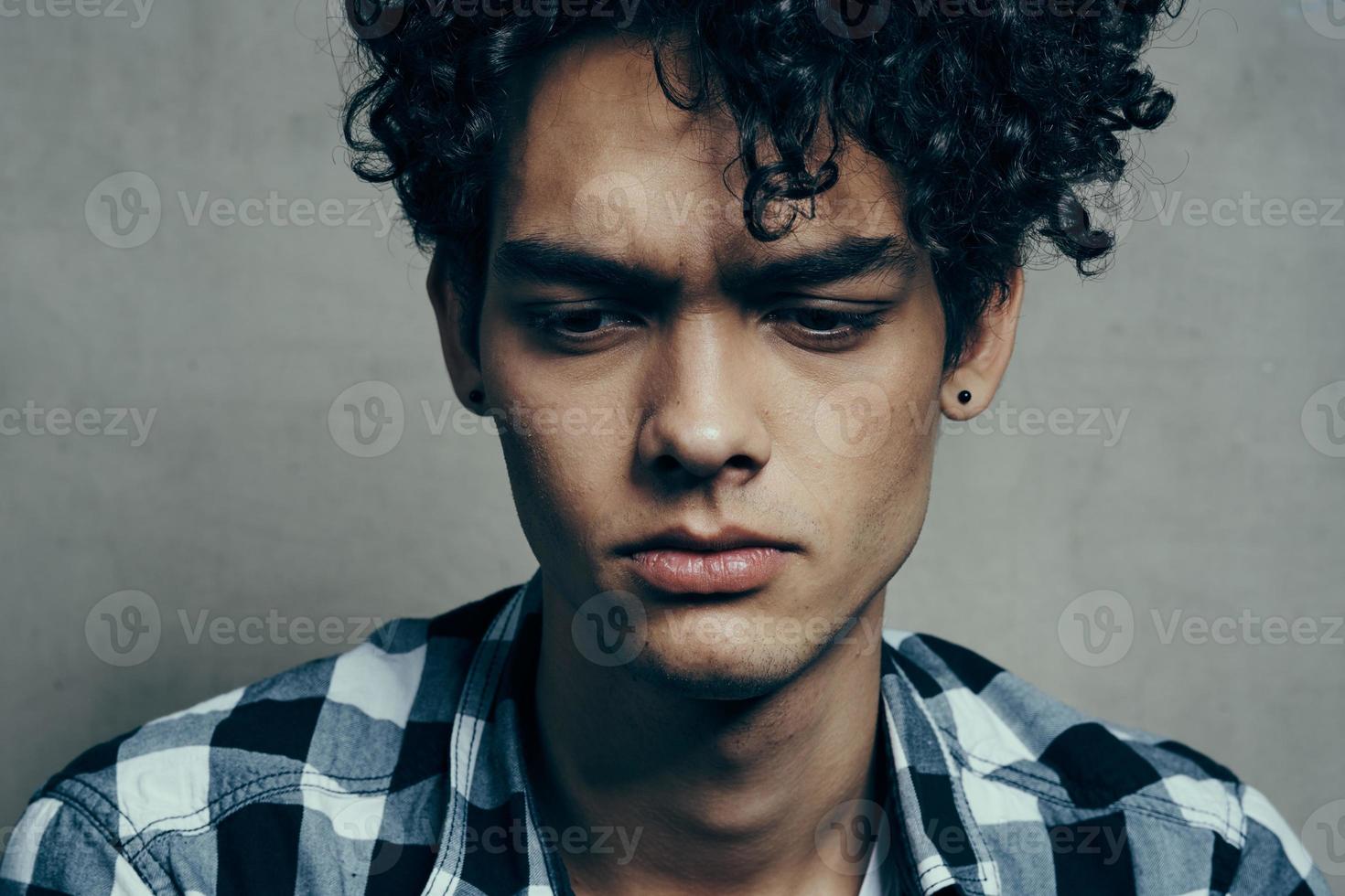 interested young man in plaid shirt puzzled look cropped view model photo