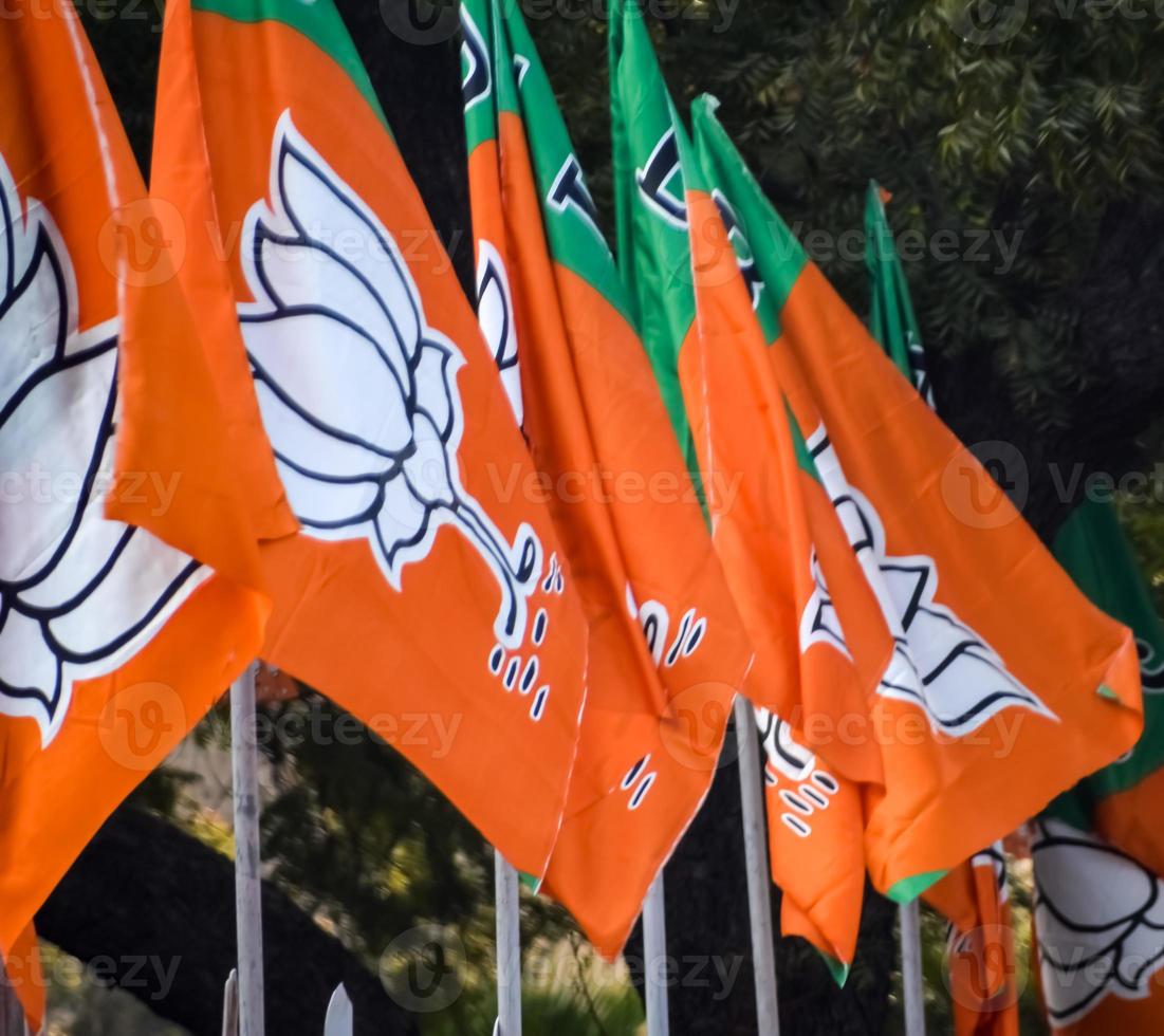 Bharatiya Janata Party Flag of Indian political party, BJP Bhartiya Janta Party Flag Waving during PM road show in Delhi, India photo