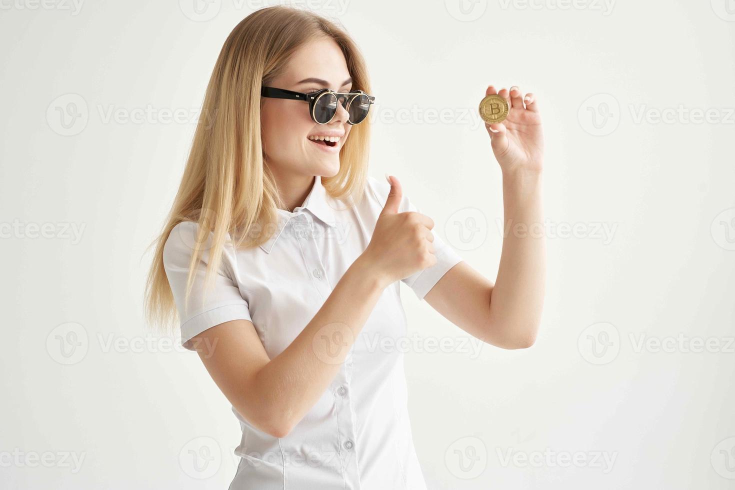 financier sunglasses Bitcoin cryptocurrency in hands isolated background photo