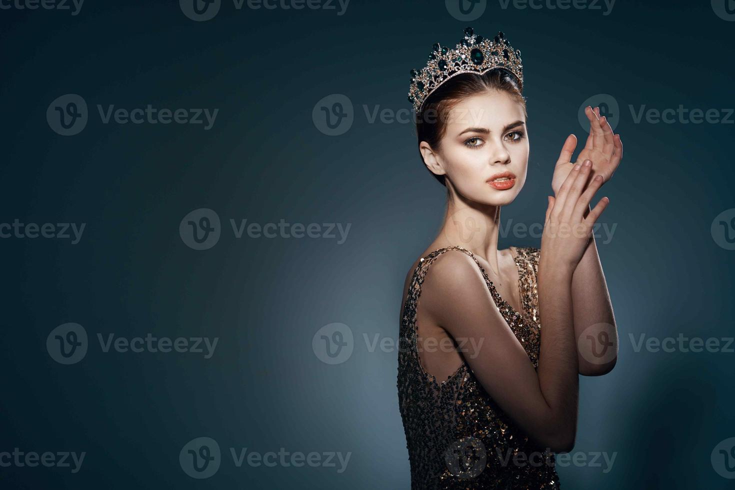 cute princess with a crown on her head decoration luxury dark background photo