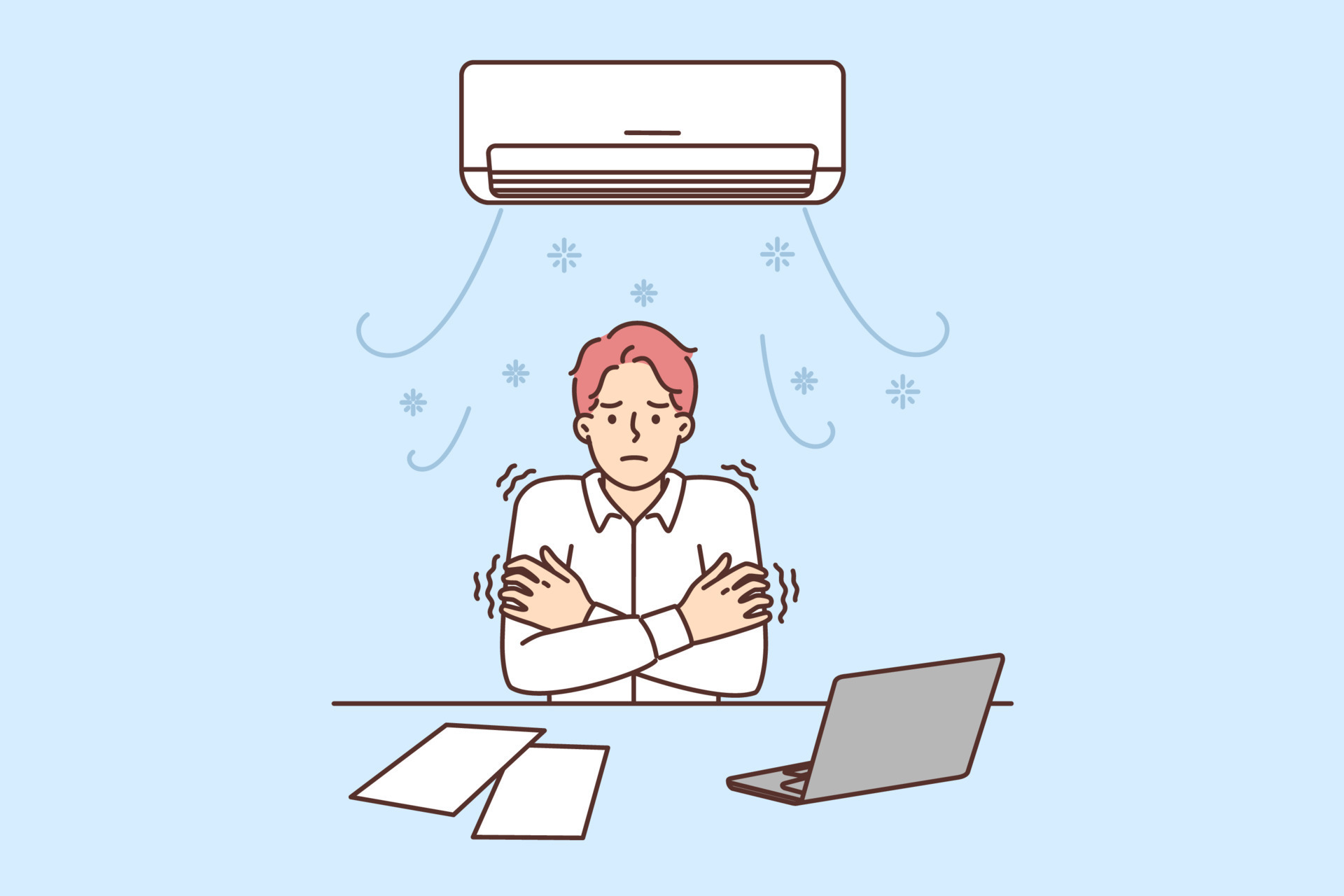 Man sitting at office desk under air conditioner freezes due to cold