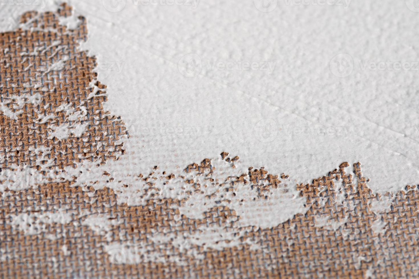 white putty spread over fiberboard rear side, messy crafts and diy background photo