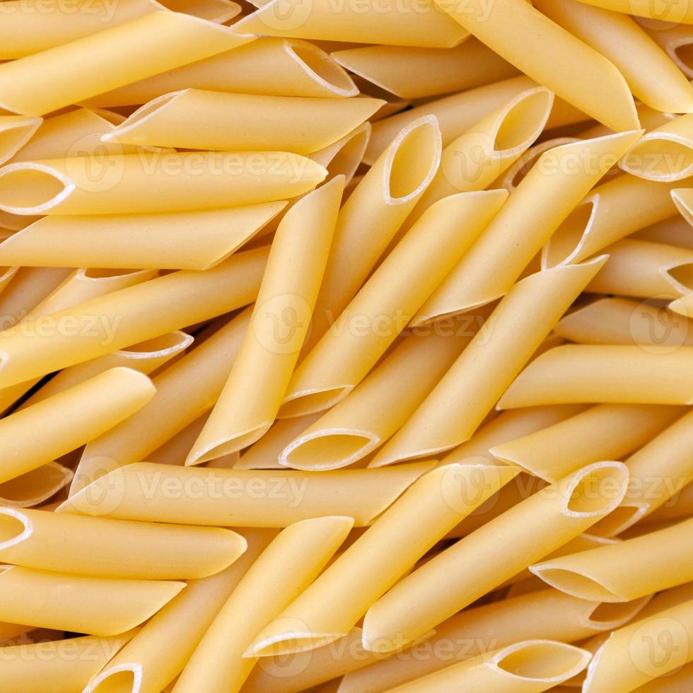 penne lisce macaroni - italian pasta background photo