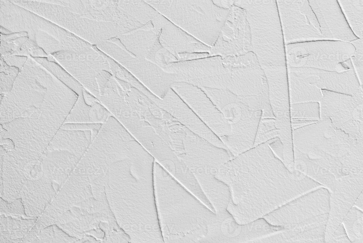 white abstract background of paste filler and bonding plaster with irregular dashes and strokes photo