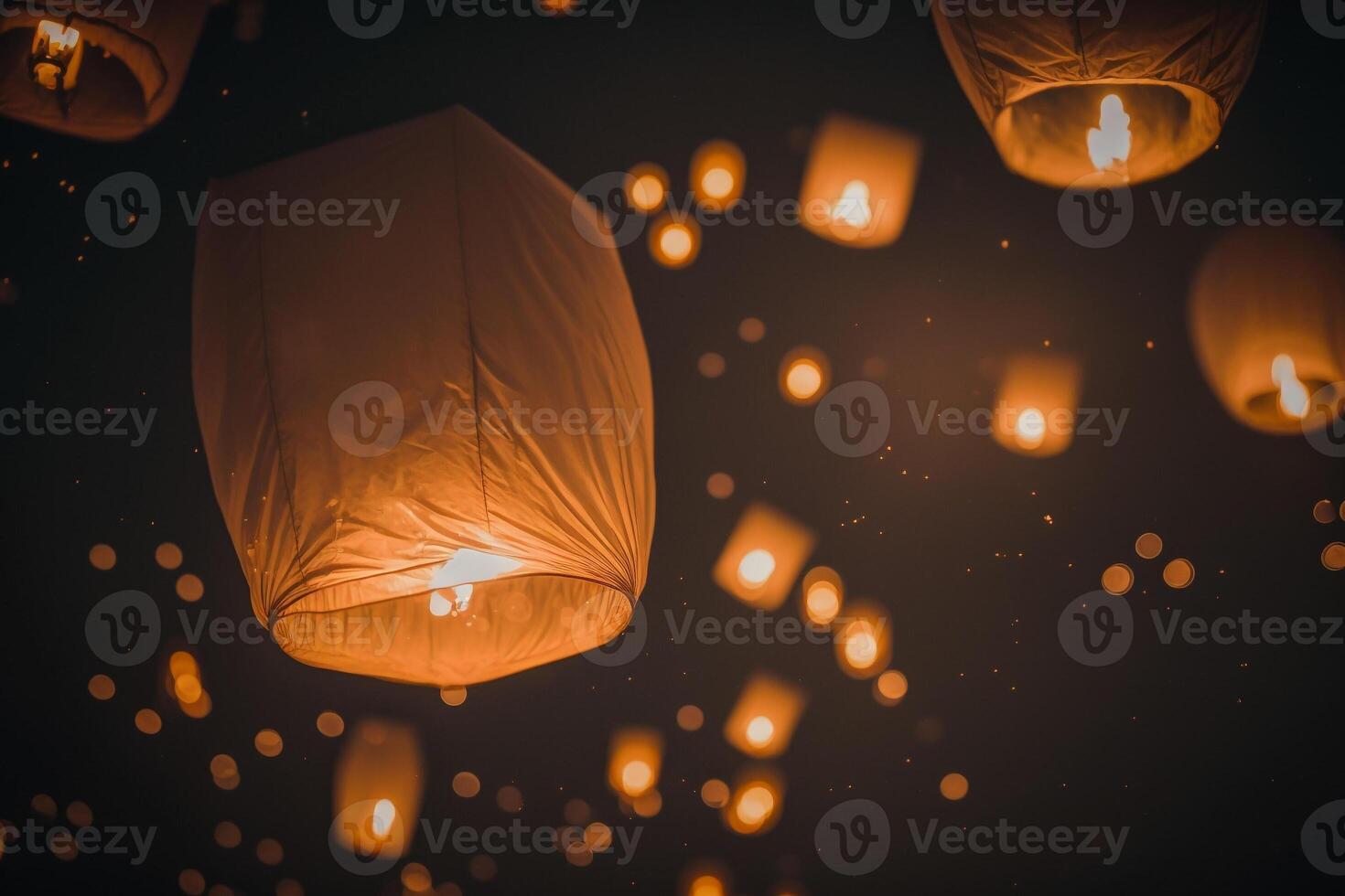 celebrating night flying paper lamps lights in the sky photo