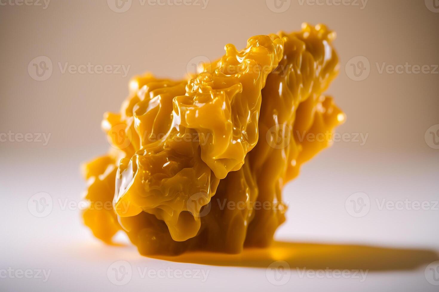 golden piece melted cannabis wax resin closeup photo