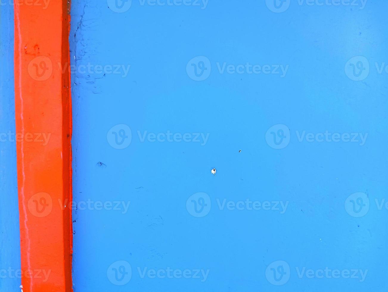 Plain walls that have two colors, namely blue and orange photo