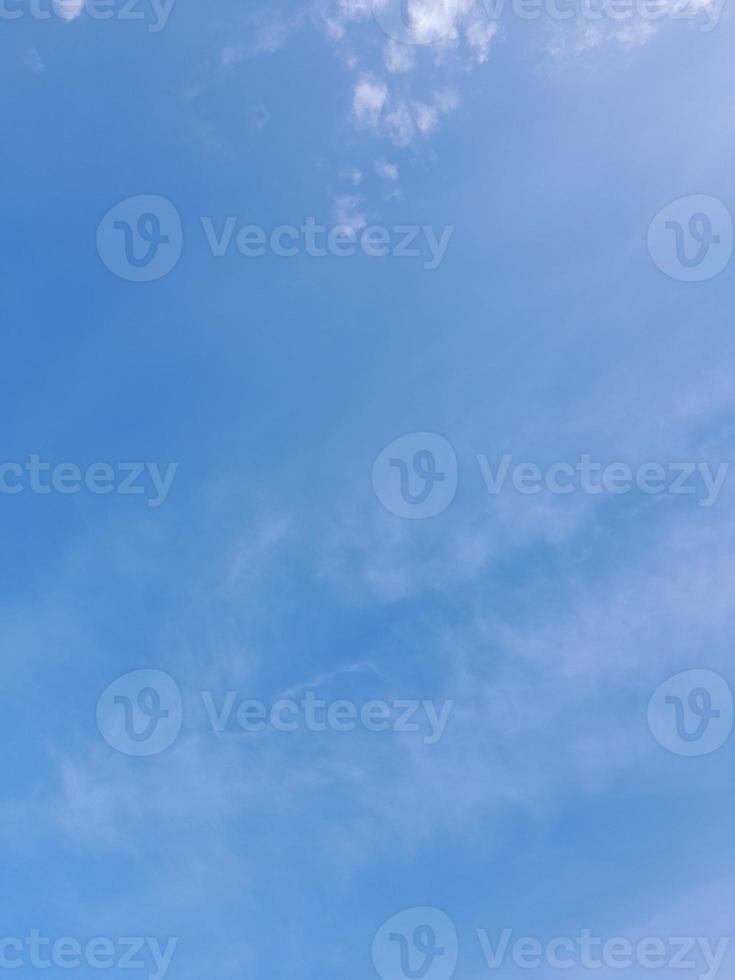 Beautiful white clouds on deep blue sky background. Large bright soft fluffy clouds are cover the entire blue sky. photo