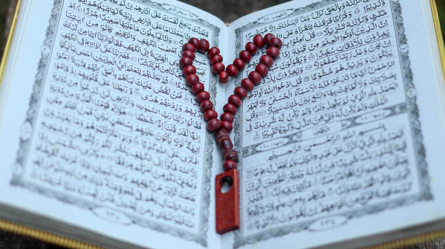The Noble Quran and tasbih photo