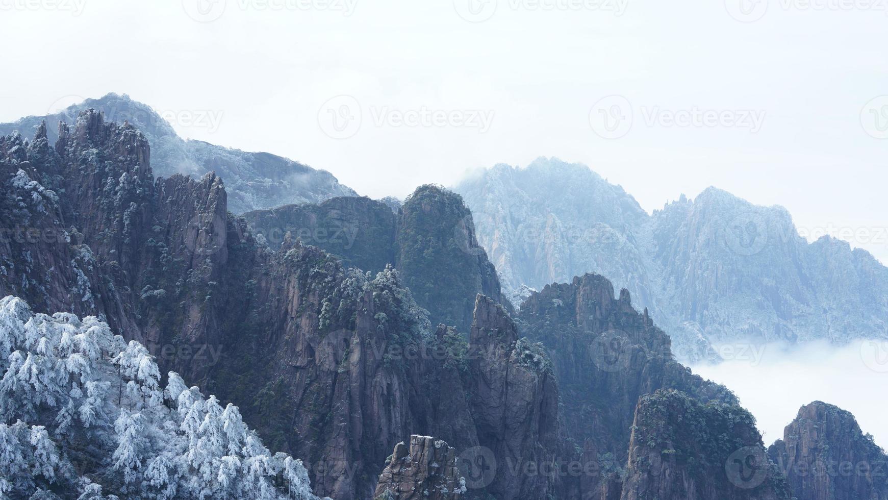 The beautiful frozen mountains view coverd by the white snow and ice in winter photo