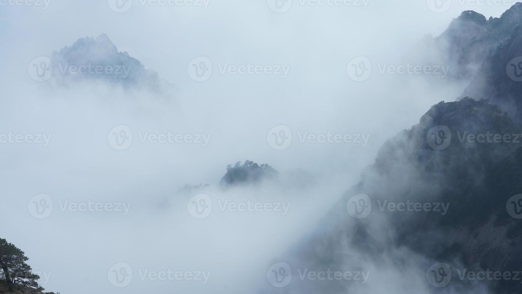 The beautiful mountains landscapes with the green forest and the erupted rock cliff as background in the countryside of the China photo