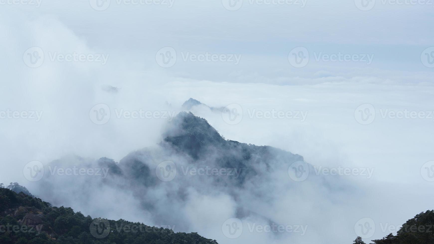The beautiful mountains landscapes with the green forest and the erupted rock cliff as background in the countryside of the China photo