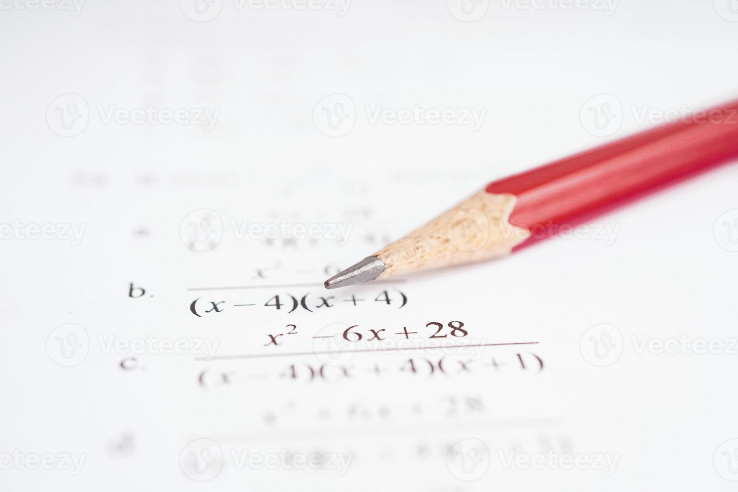 Pencil on mathematic formula exercise test paper in education school. photo